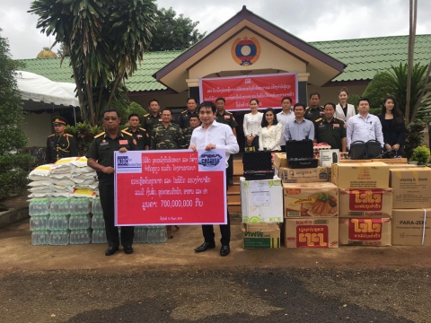 aidc company helping the suffering and the disasters in  champasak with cash  equipment  food and medicine total value 700 000 000 kip